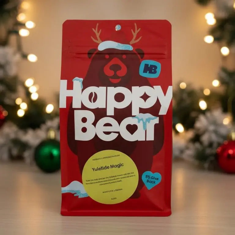 Red 'Happy Bear' package with a Christmas tree and ornaments in the background